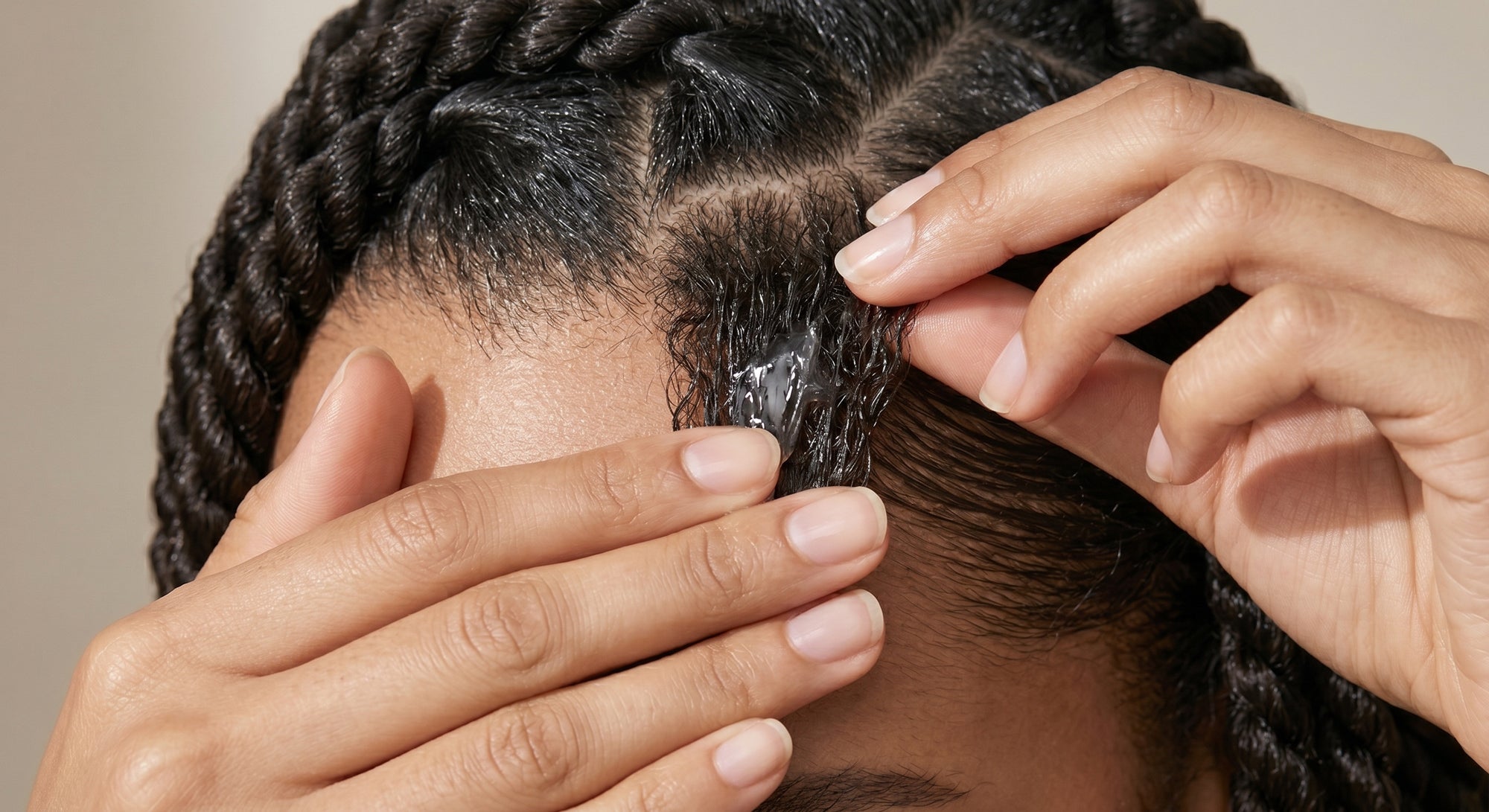 applying Iwell signature's locking gel to roots for twists to create clean parts and long-lasting hold on natural hair