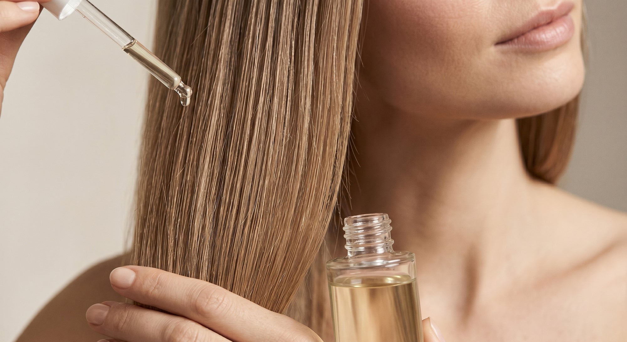 applying lightweight hair oil to mid lengths and ends for thin hair to add shine without weighing it down